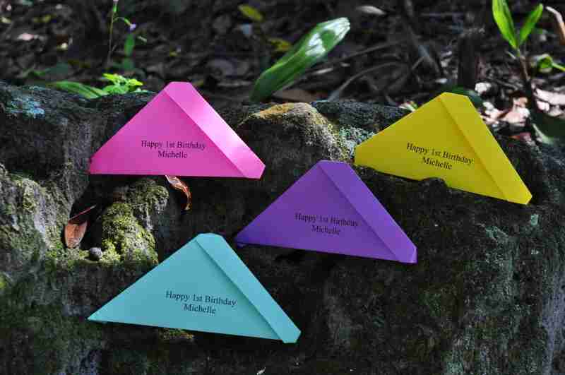 Four colorful personalized birthday butterfly release envelopes